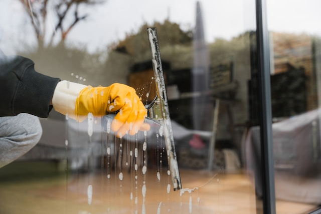 someone cleaning a window